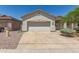 Charming single-story home with a neutral color palette, desert landscaping, and a two-car garage at 15034 N 30Th St, Phoenix, AZ 85032