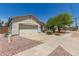 A well-maintained single-story home with a desert landscape, wide driveway, and a two-car garage at 15034 N 30Th St, Phoenix, AZ 85032