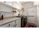 Functional laundry room with cabinets, counter space, and modern appliances at 15034 N 30Th St, Phoenix, AZ 85032