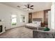 Bright main bedroom with access to a backyard patio, a modern fireplace, and stylish accent wall at 15034 N 30Th St, Phoenix, AZ 85032