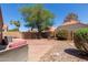 Spacious backyard with brick pavers, rocks, seating area, plants and a privacy fence at 1534 E Mineral Rd, Gilbert, AZ 85234