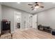 Spacious bedroom featuring wood-look floors, a ceiling fan, and recessed lighting at 1534 E Mineral Rd, Gilbert, AZ 85234