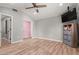 Bedroom with wood-look floors, a ceiling fan, and a closet with a rod and shelving for optimal storage at 1534 E Mineral Rd, Gilbert, AZ 85234