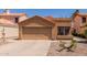 Inviting single-story home with a two-car garage and low-maintenance landscaping at 1534 E Mineral Rd, Gilbert, AZ 85234
