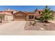 Charming single-story home with a two-car garage and desert landscaping in a residential neighborhood at 1534 E Mineral Rd, Gilbert, AZ 85234