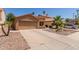 Charming single-story home with a two-car garage and xeriscape landscaping in a suburban setting at 1534 E Mineral Rd, Gilbert, AZ 85234