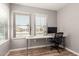 Bright home office with large windows, modern desk, and comfortable chair, perfect for working remotely at 1534 E Mineral Rd, Gilbert, AZ 85234