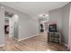 Spacious living area featuring stylish wood-look tile floors and neutral gray walls with seamless flow throughout the home at 1534 E Mineral Rd, Gilbert, AZ 85234