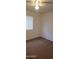 A cozy bedroom with carpet flooring, a window that allows for natural light, and neutral-colored walls at 16021 N 30Th St # 113, Phoenix, AZ 85032