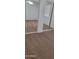 Bedroom featuring mirrored closet doors and neutral carpet, enhancing space and light at 16021 N 30Th St # 113, Phoenix, AZ 85032