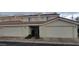 Townhome showcasing attached garages, front door, and desert landscaping creating a welcoming curb appeal at 16021 N 30Th St # 113, Phoenix, AZ 85032