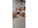 Spacious kitchen with oak cabinets, tile floors, and modern black and white appliances at 16021 N 30Th St # 113, Phoenix, AZ 85032