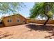 Spacious backyard featuring a covered patio, perfect for outdoor entertaining and relaxation at 16118 W Morning Glory St, Goodyear, AZ 85338
