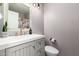 Bathroom vanity features shaker-style cabinets and brushed gold faucet at 16118 W Morning Glory St, Goodyear, AZ 85338