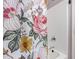 Bathroom with shower featuring colorful floral shower curtain and white tiled walls at 16118 W Morning Glory St, Goodyear, AZ 85338
