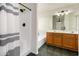 Bathroom featuring a tiled shower, a soaking tub, and dual sink vanity at 16118 W Morning Glory St, Goodyear, AZ 85338