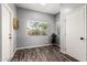 Cozy bedroom with neutral walls, wood look flooring, and natural light at 16118 W Morning Glory St, Goodyear, AZ 85338