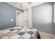 Cozy bedroom with neutral color scheme and ceiling fan fixture at 16118 W Morning Glory St, Goodyear, AZ 85338