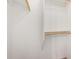 Open walk-in closet featuring a wooden clothes bar, and an additional shelf at 16118 W Morning Glory St, Goodyear, AZ 85338