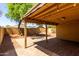 Well-lit covered patio with pavers, offering an ideal outdoor living space with backyard view at 16118 W Morning Glory St, Goodyear, AZ 85338
