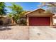 Charming home with low maintenance landscaping, flowering bushes, and a two car garage at 16118 W Morning Glory St, Goodyear, AZ 85338