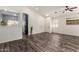 Spacious living room features wood-look floors, ceiling fans, and an open floor plan at 16118 W Morning Glory St, Goodyear, AZ 85338