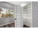 Open pantry with adjustable wire shelving and a storage door for added convenience at 16118 W Morning Glory St, Goodyear, AZ 85338