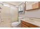 Well lit bathroom with a shower/tub combo, vintage vanity with a drop in sink, and toilet at 17200 W Bell Rd # 2189, Surprise, AZ 85374