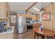Bright kitchen features stainless steel appliances and a table with chairs at 17200 W Bell Rd # 2189, Surprise, AZ 85374