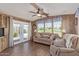 Comfortable living room with a ceiling fan and natural lighting at 17200 W Bell Rd # 2189, Surprise, AZ 85374