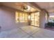 Covered back patio with ceiling fan and access to the interior kitchen and backyard at 17911 N Adobe Mesa Ct, Surprise, AZ 85374