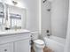 Bathroom featuring a shower and tub combination with modern fixtures and a vanity sink at 17911 N Adobe Mesa Ct, Surprise, AZ 85374