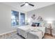 Comfortable bedroom with plenty of natural light, a ceiling fan, and stylish decorations and furnishings at 17911 N Adobe Mesa Ct, Surprise, AZ 85374
