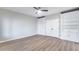 Bedroom featuring wood floors and white built-in shelving and cabinets at 17911 N Adobe Mesa Ct, Surprise, AZ 85374