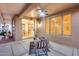 Inviting covered patio with ceiling fan and views of the dining area offers outdoor relaxation at 17911 N Adobe Mesa Ct, Surprise, AZ 85374