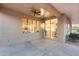 Comfortable covered patio space with open view to the interior kitchen and dining areas at 17911 N Adobe Mesa Ct, Surprise, AZ 85374