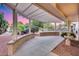 Extended covered patio with backyard views, ideal for enjoying outdoor moments and entertaining guests at 17911 N Adobe Mesa Ct, Surprise, AZ 85374
