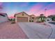 Beautiful single-story home with well-maintained landscaping and a spacious driveway at 17911 N Adobe Mesa Ct, Surprise, AZ 85374