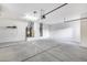 Spacious garage with concrete floors, water heaters, and garage door opener at 17911 N Adobe Mesa Ct, Surprise, AZ 85374