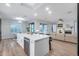 Modern kitchen with a large center island, sleek countertops, and an open view to the living room, ideal for entertaining at 17911 N Adobe Mesa Ct, Surprise, AZ 85374