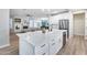 Elegant kitchen with a spacious island, stainless steel appliances, and open layout to the living area at 17911 N Adobe Mesa Ct, Surprise, AZ 85374
