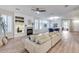 Inviting living room with a cozy fireplace, contemporary decor, and view of dining area, perfect for relaxing evenings at 17911 N Adobe Mesa Ct, Surprise, AZ 85374