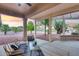 Relaxing covered patio with comfortable seating, perfect for enjoying the outdoor space at 17911 N Adobe Mesa Ct, Surprise, AZ 85374