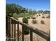 Landscaped community space with trees, walking trails, plants, and a nearby foot bridge at 18008 W Ocotillo Ave, Goodyear, AZ 85338