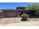 Charming single-Gathering home with a two-car garage, brick driveway, and drought-tolerant landscaping at 18008 W Ocotillo Ave, Goodyear, AZ 85338