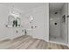 Bright and airy bathroom featuring a soaking tub, a glass-enclosed shower, and dual sinks at 2106 W 8Th Ave, Mesa, AZ 85202