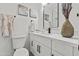 Stylish bathroom featuring a modern vanity with black hardware and decorative elements at 2106 W 8Th Ave, Mesa, AZ 85202