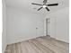 A cozy bedroom features streamlined floors, a ceiling fan, and a spacious closet at 2106 W 8Th Ave, Mesa, AZ 85202