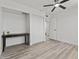 Well-lit bedroom featuring light wood floors and a sliding closet at 2106 W 8Th Ave, Mesa, AZ 85202