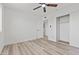 Bright bedroom with modern fan, neutral walls, and updated closet at 2106 W 8Th Ave, Mesa, AZ 85202
